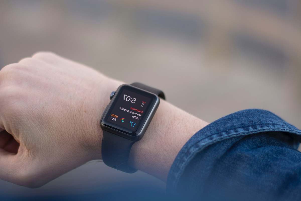 wristwatch apple watch showing 5:07 digital watch